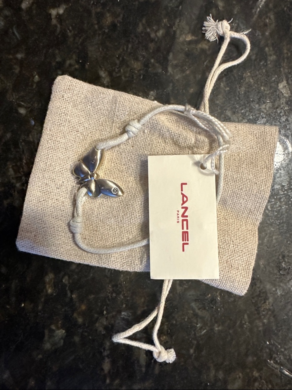 LANCEL Silver Butterfly Charm Cord Bracelet - Cream Cord